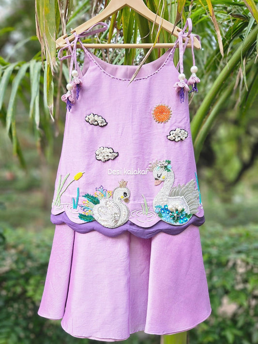 Lavender handcrafted zardozi embroidered swan motif A-line top and flared pants set with pearl tassels for girls by Desi Kalakar.
